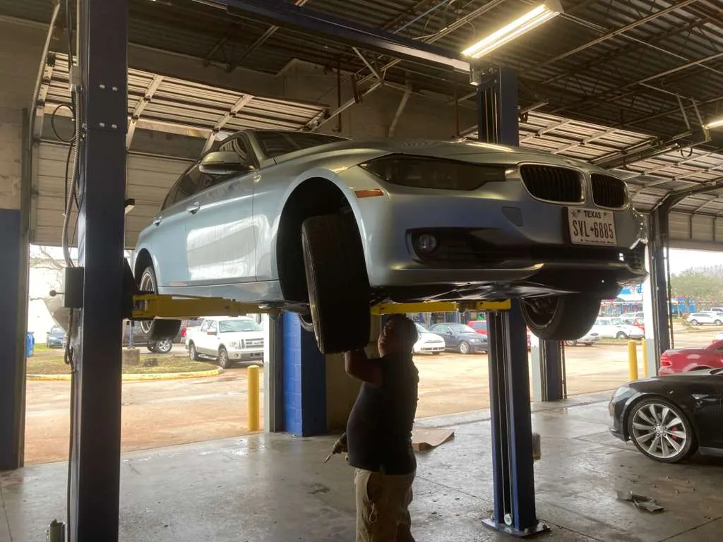 Professional tire inspection and auto repair service at Bay Area Auto in Webster TX